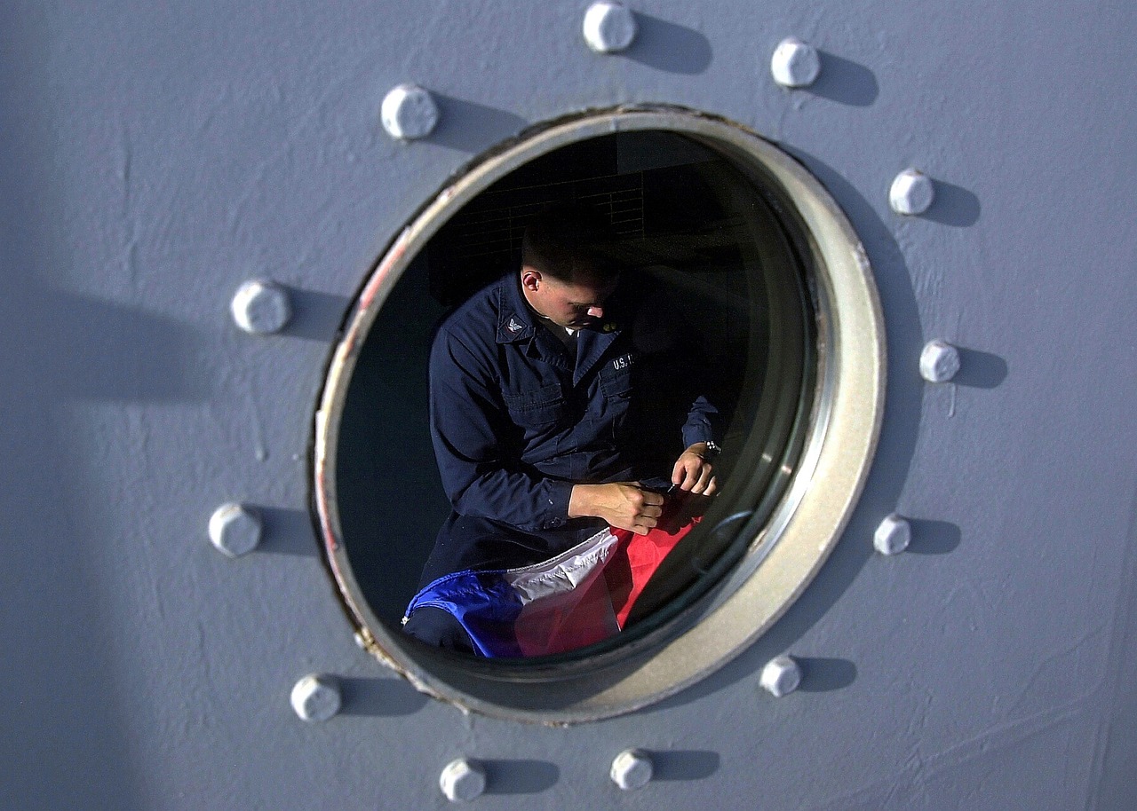 ship, porthole, man, mending a flag, us navy, at sea, working, porthole, porthole, porthole, porthole, us navy, us navy, us navy, us navy, us navy