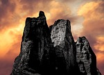 Rocks cliff cliff face sunset clouds sky mountain nature extreme landscape outdoor high nature background nature landscape peak scenic scenery mountain top