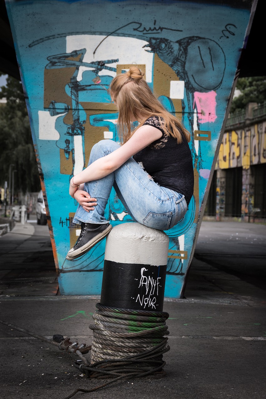 teenager, desperate, sad, depressed, hopeless, loss, worries, youthful, despair, depression, sadness, grief, tears, defenseless, alone, lonely, bullying, emotion, young, person, human, problem, pulled back, female, graffiti, grafitti, wait, jeans, sneaker, chucks, modern, alternatively, youth, teen, sneakers