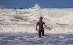 Surfer sea waves surf surfboard splash foam ocean water water sport sport woman recreation activity adventure vacation holiday