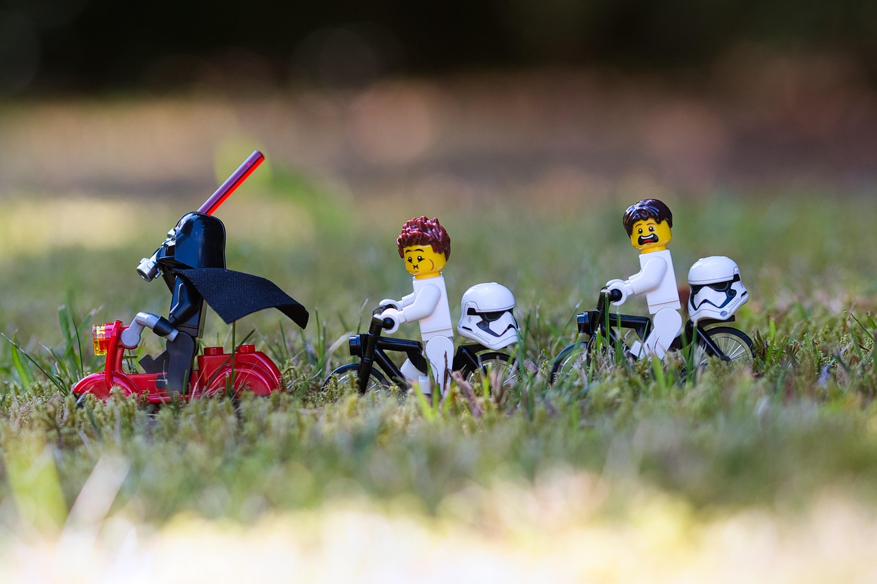 lego, star wars, nature, toy, darth vader, stormtrooper, lightsaber, scooter, bicycle, weapon, miniature, science fiction, sci fi, grass, outdoors, bokeh, macro, closeup