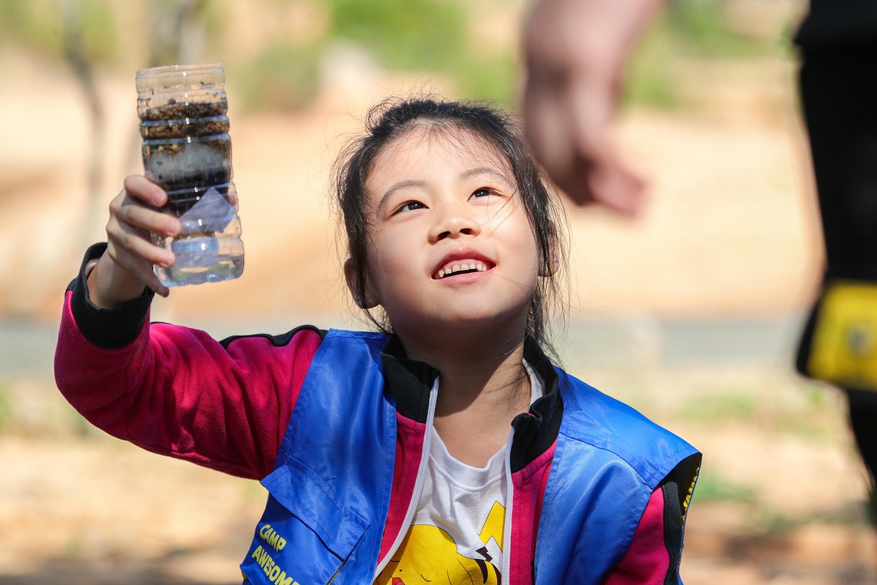 girl, chinese, purified water filter, happy, camping, child, kid, young, little girl, outdoors, learning, camp education, outdoor activities, filtered water, purified water, filtered water device