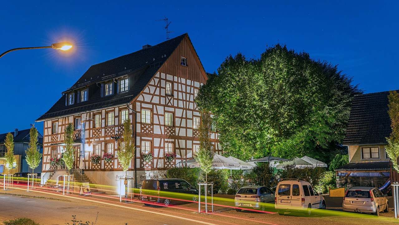 half-timbered house, hotel, building, town, cars