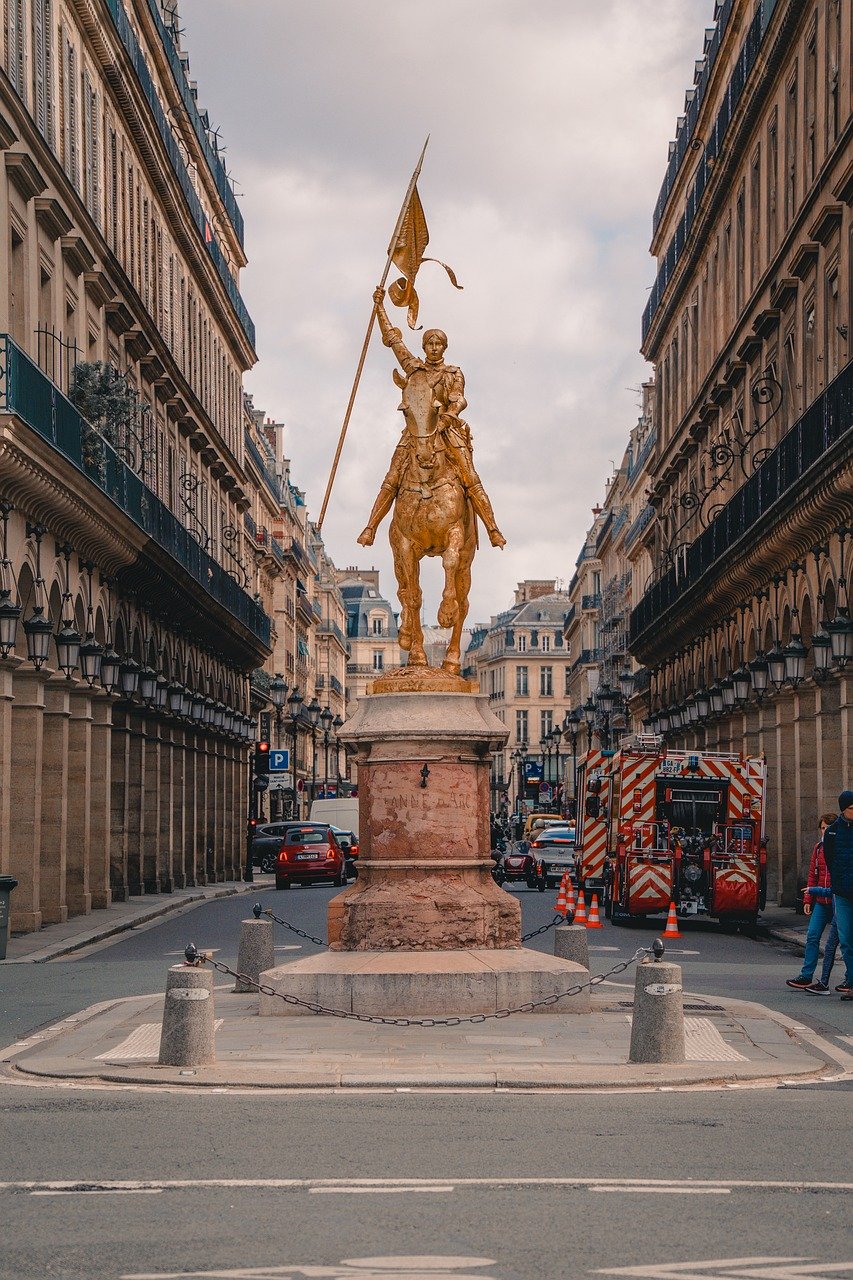 joan of arc, paris, france, equestrian statue, gold statue, historical figure, monument, place of pyramids, medieval, patriotism, woman warrior, french history, sculpture, public art, tourism attraction, french heroine, historical landmark, paris street, architecture, national symbol